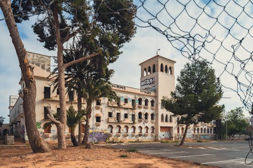 Abandoned Building behind Fence