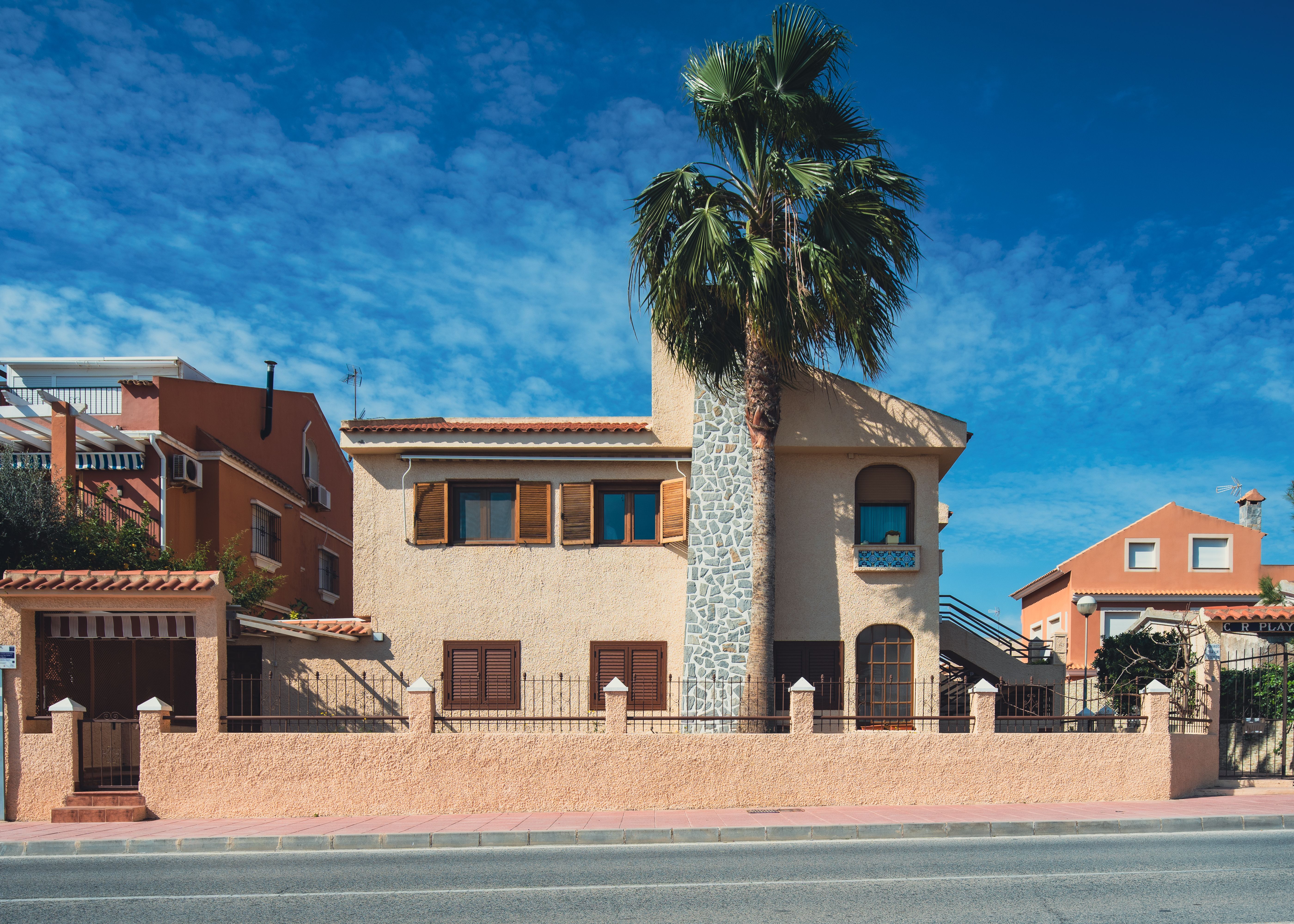 Simple Spanish Rural House with Palm Tree in Front · Free Stock Photo