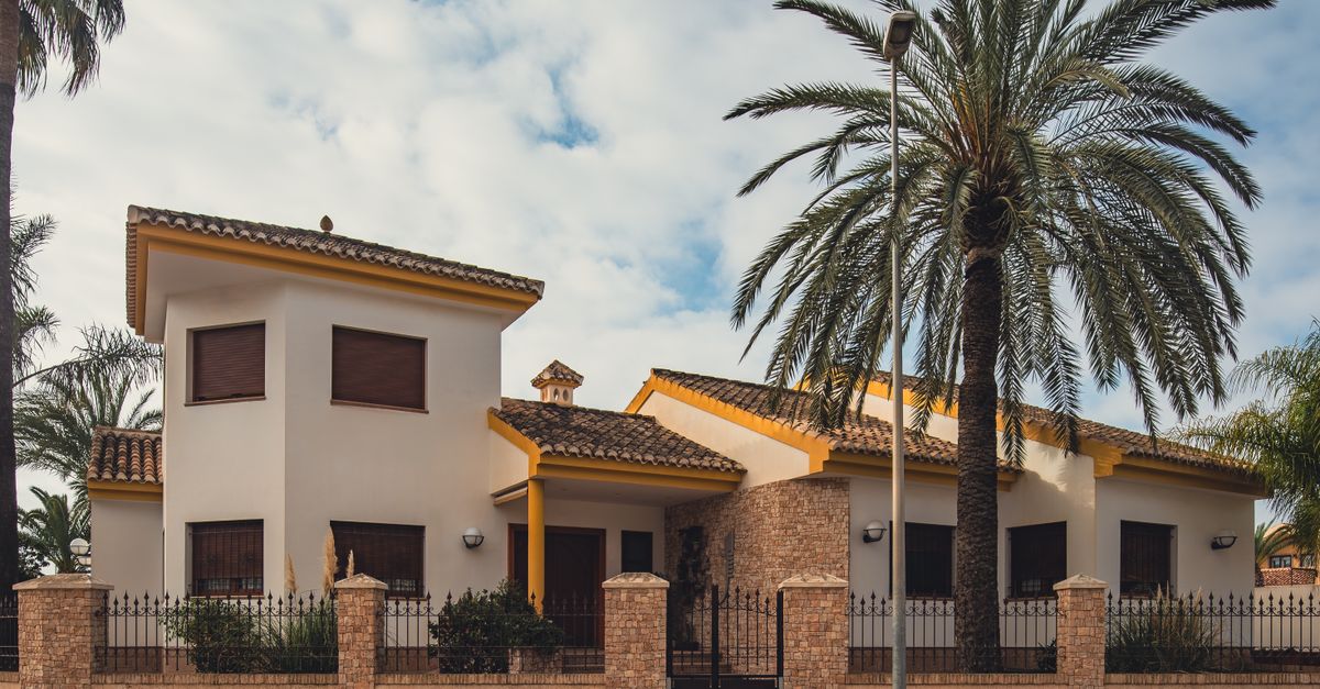 Charming Spanish villa in San Javier with palm trees and Mediterranean architecture.