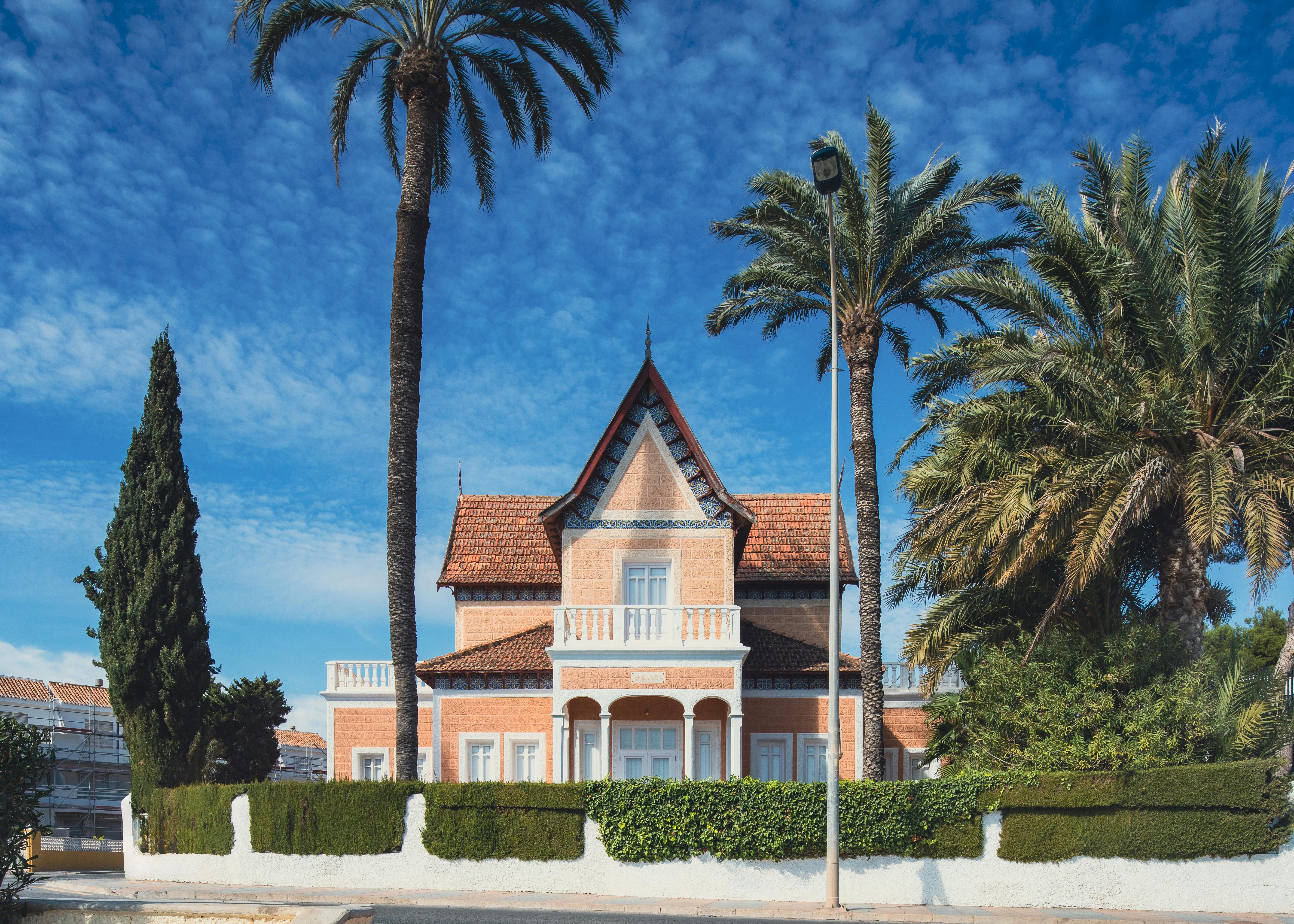 A picturesque Spanish villa surrounded by palm trees in San Javier, Spain.