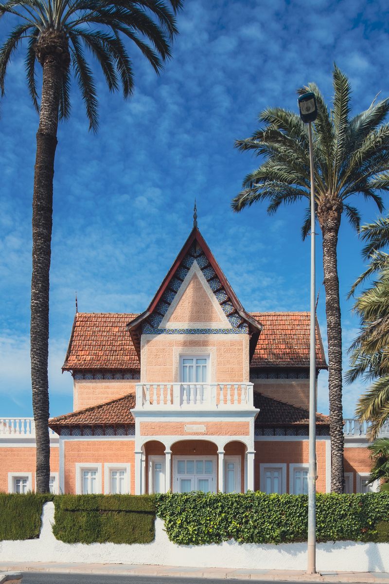 A picturesque Spanish villa surrounded by palm trees in San Javier, Spain.
