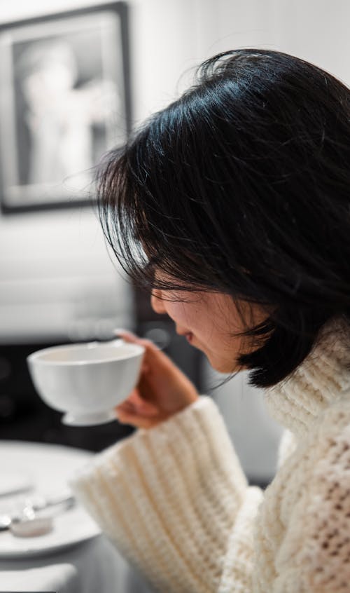 A woman drinking coffee in a cafe