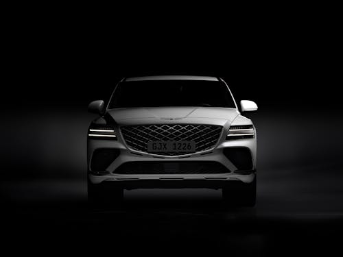 The front view of the GV80 Coupe standing in a dark studio.