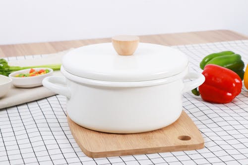 White Cooking Pot and Raw Bell Peppers