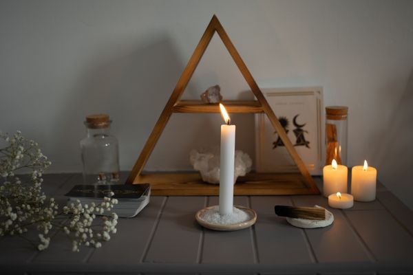 Ritual candles with crystals and flowers