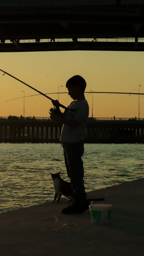 Silhouette of Man with Fishing Rod 