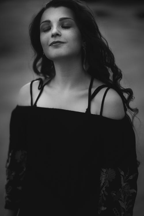 Greyscale Photography of Woman Wearing Off Shoulder Dress