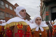 Men dressed as traditional Gilles during the famous Binche Carnival parade in Belgium.