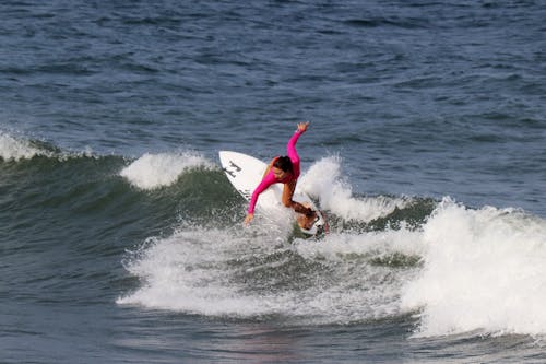 Photo of a Woman Surfing 