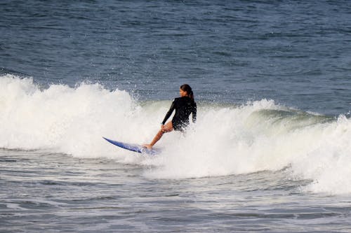Photo of a Woman Surfing 