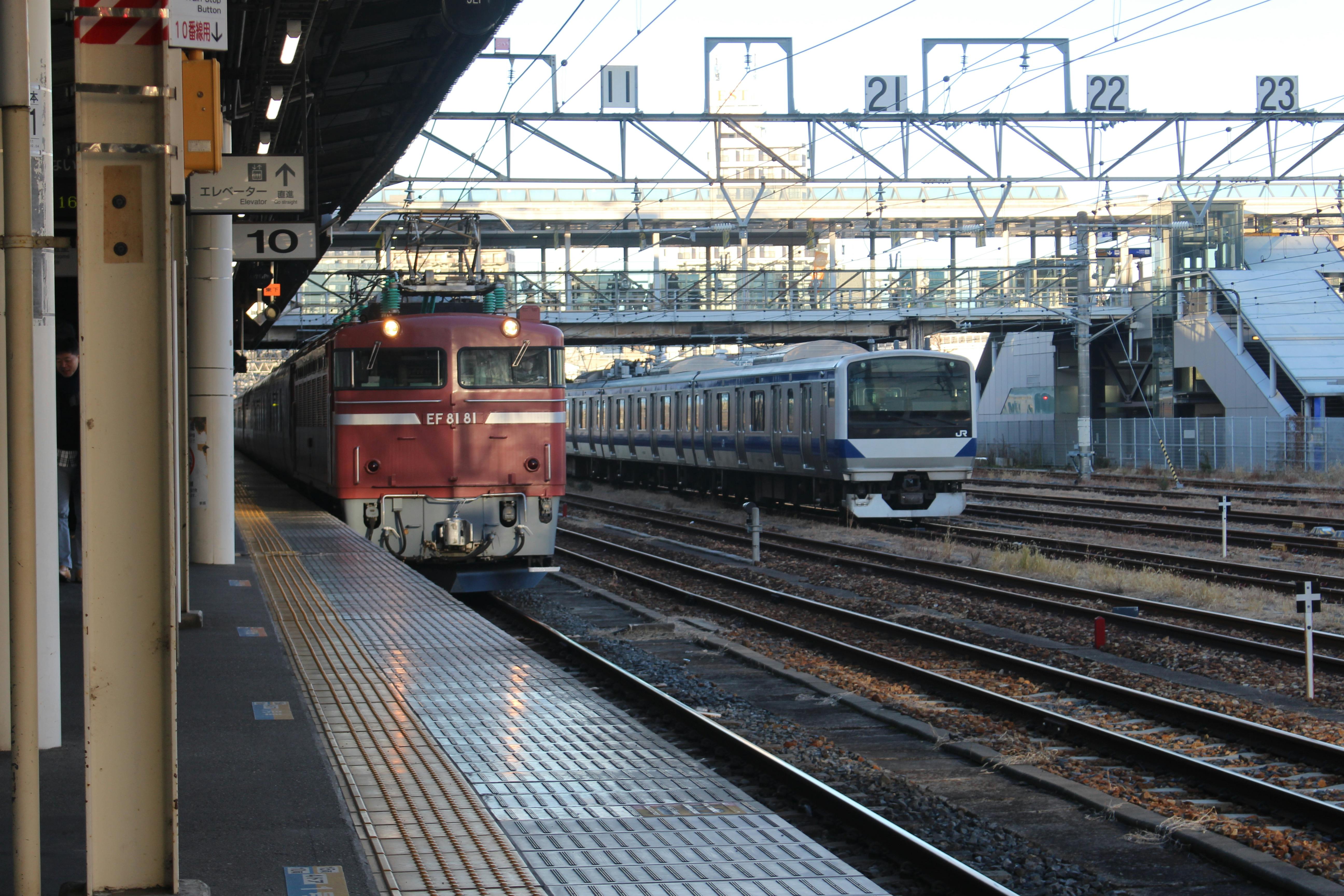 View of trains at Utsunomiya Station with tracks and platforms in Tochigi, Japan.
