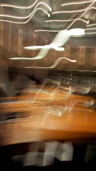 Dynamic abstract motion blur in an Icelandic interior setting showcasing lights and textures.