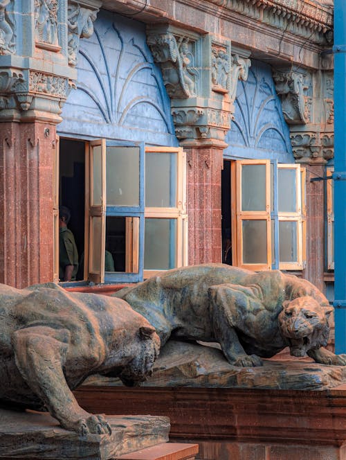 Two statues of lions on a building