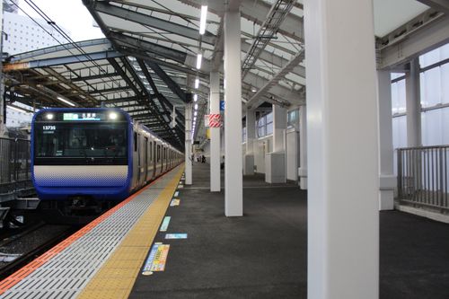 Free A train arrives at Musashi Kosugi Station in Kawasaki, Japan, showcasing modern transportation. Stock Photo