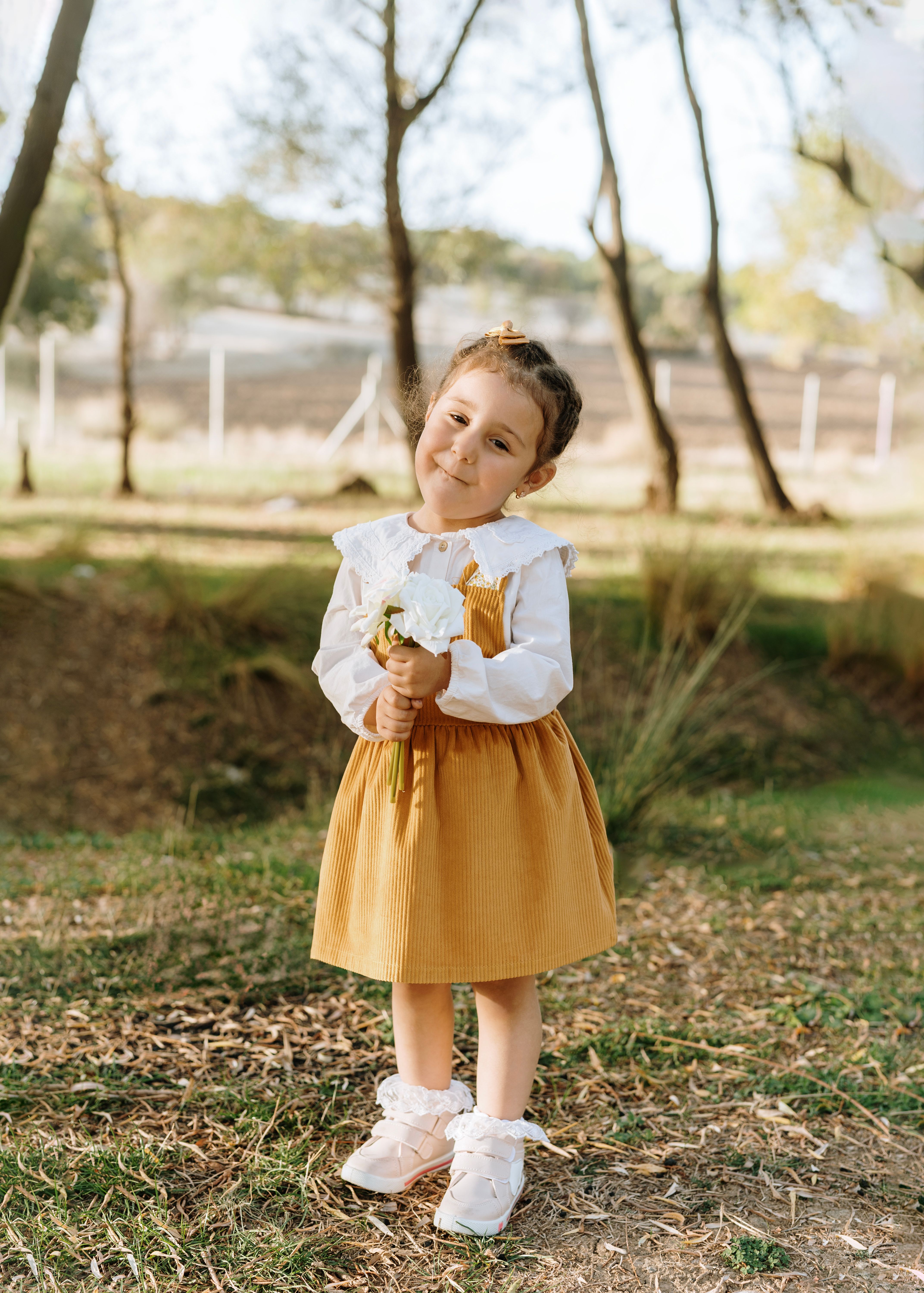 Girl in Yellow Dress Standing at Park · Free Stock Photo