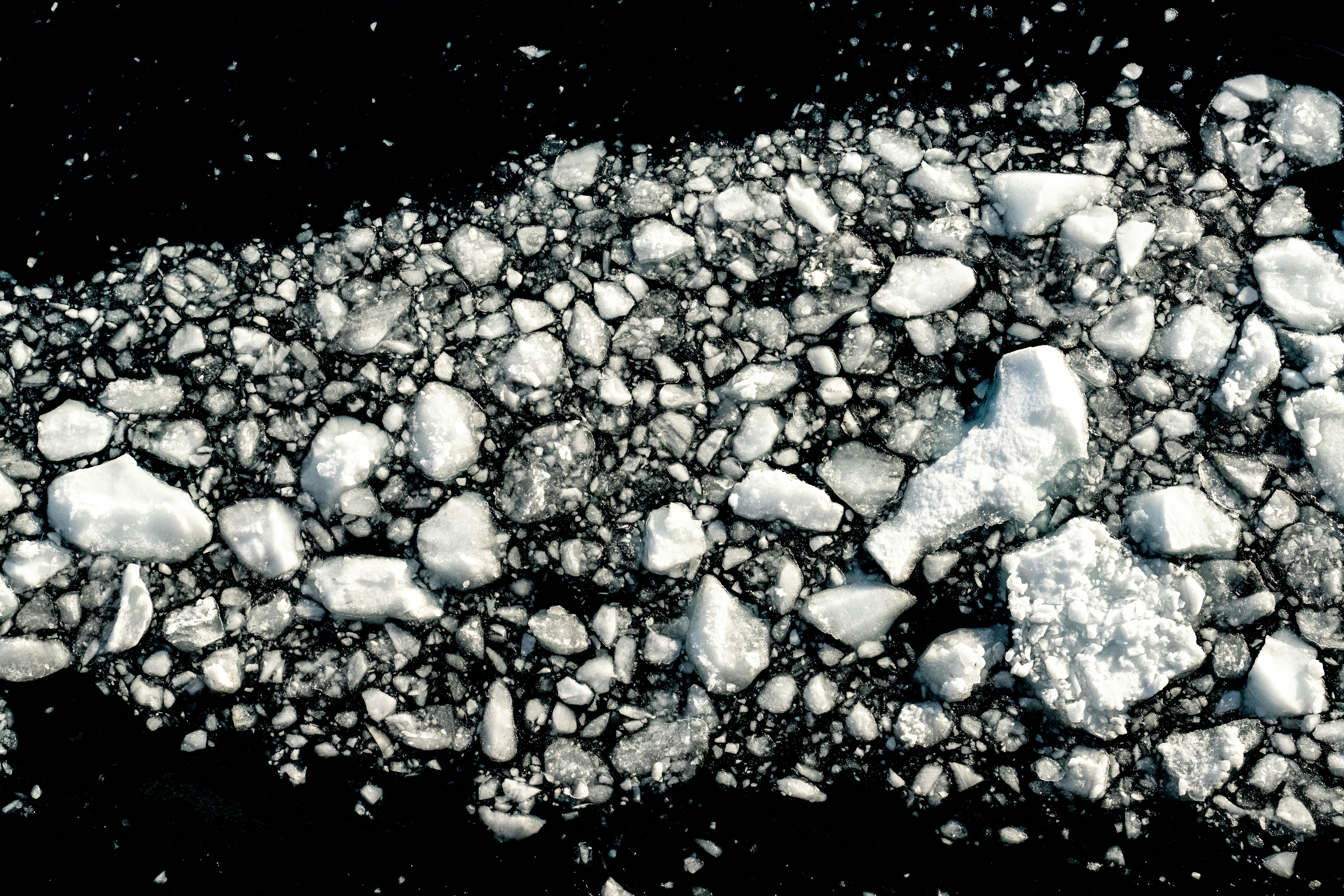 Scenic aerial shot of floating ice floes in Antarctica's cold waters, depicting winter's icy beauty.