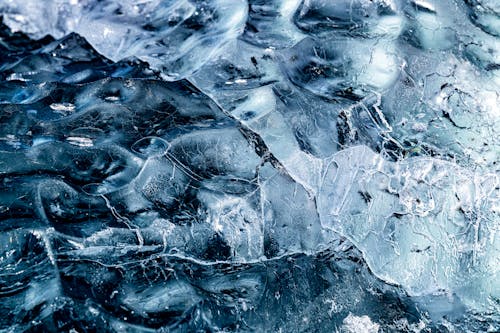 Icebergs in the water, with blue and white ice