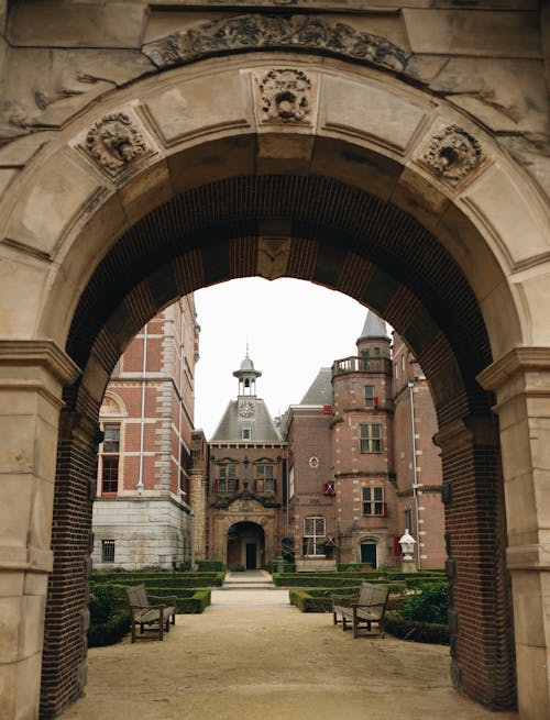 The entrance to a castle with a clock tower