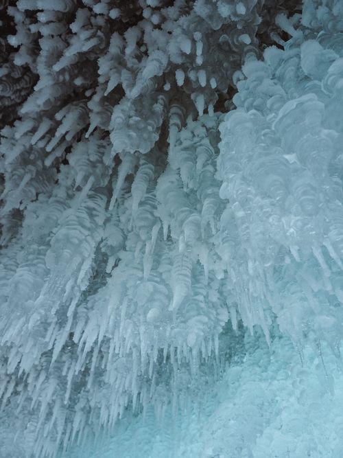 Free Close-up of stunning icicle formations hanging from an overhang in winter. Stock Photo