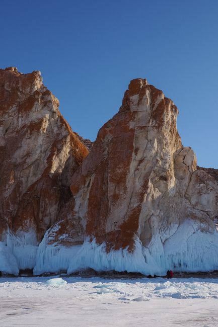 Stunning winter view of icy cliffs at Lake Baikal, showcasing natural rugged beauty in Siberia.