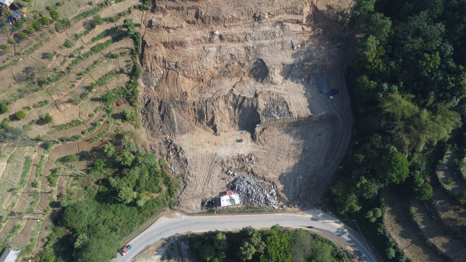 Spectacular Landing Everest Base Camp Kalapathar by Helicopter with Breakfast Review 2026 - Drone shot of an excavation site beside terraced fields in Panauti, Nepal.