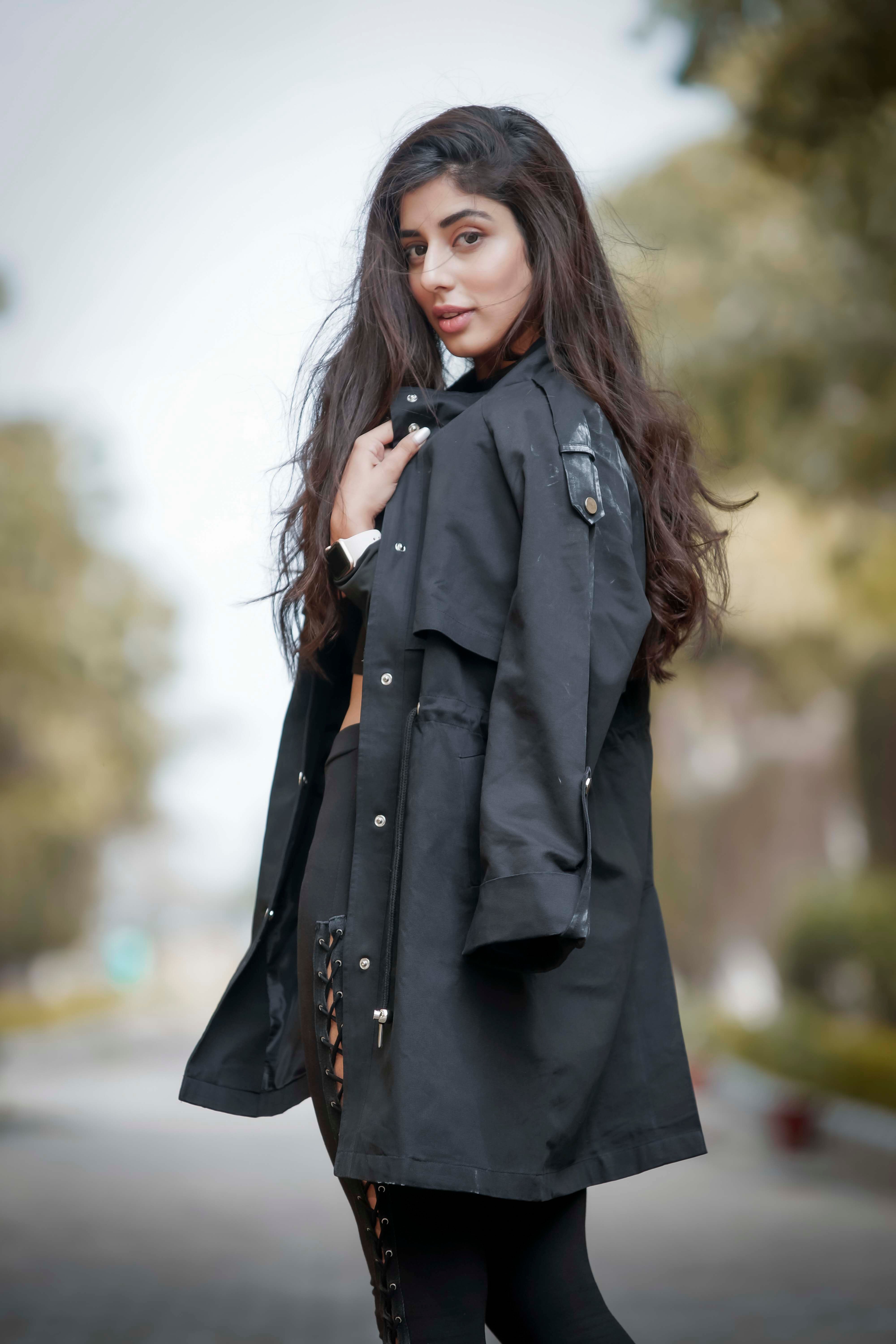 Brunette Woman in Black Coat Posing on Street · Free Stock Photo
