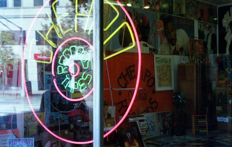 Neon Signage Turned-on Glass Window