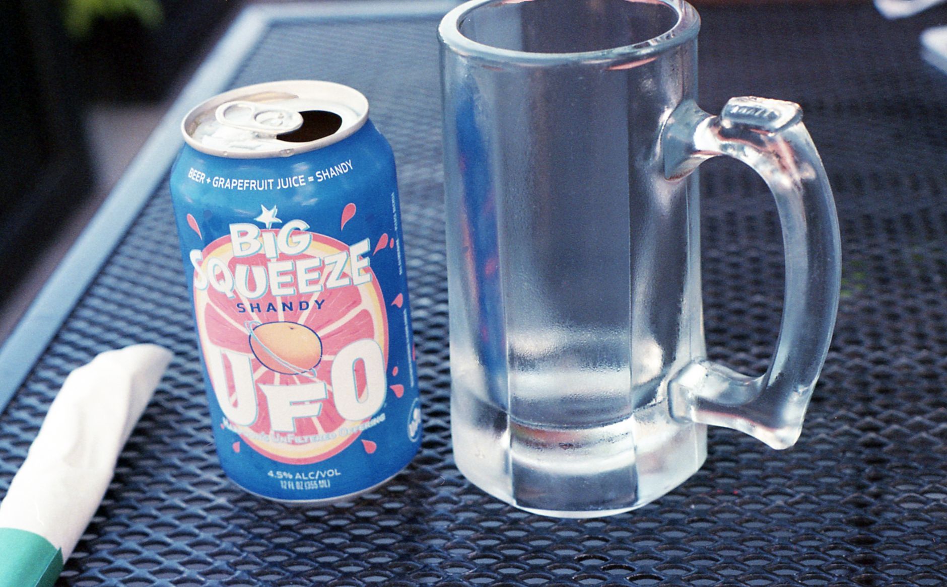 Two glasses of radler and shandy side by side on a wooden table