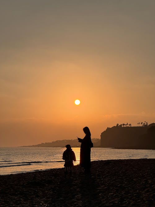 Free Silhouettes on Beach Stock Photo