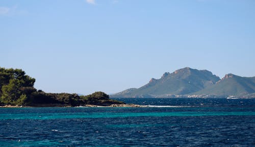 Gratis stockfoto met achtergrond, bergen, blauw water