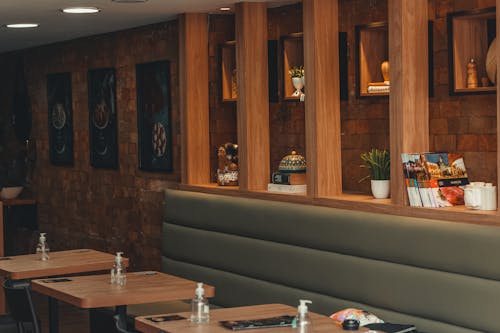 Interior of Restaurant with Tables Sofa Decorations and Brick Wall