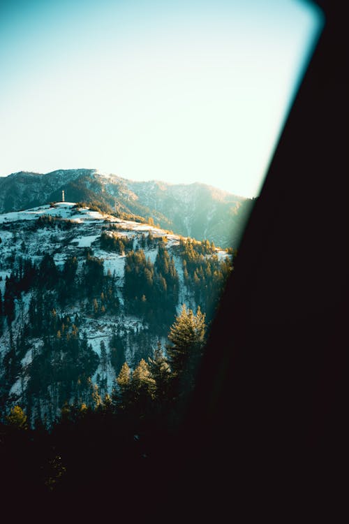 A view of a mountain range from inside a car