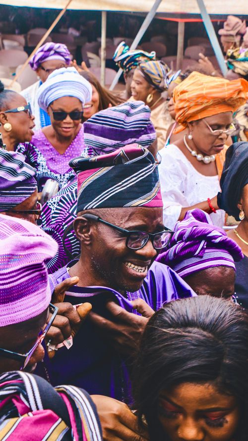 Free A lively gathering of people in colorful traditional clothing, capturing a joyous cultural celebration. Stock Photo