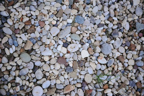 A close up of a pile of rocks and pebbles