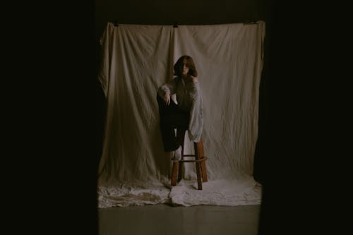 Woman Posing in a Dark Studio 