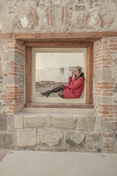 Woman Sitting on Window 