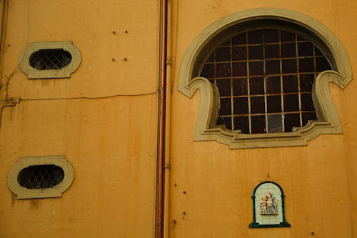 A window with a sign on it and a small window