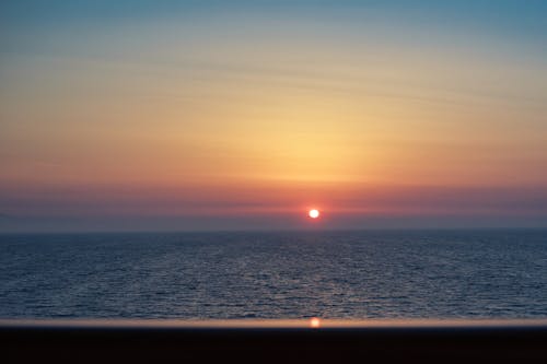Sunset on the ocean from the balcony of a cruise ship