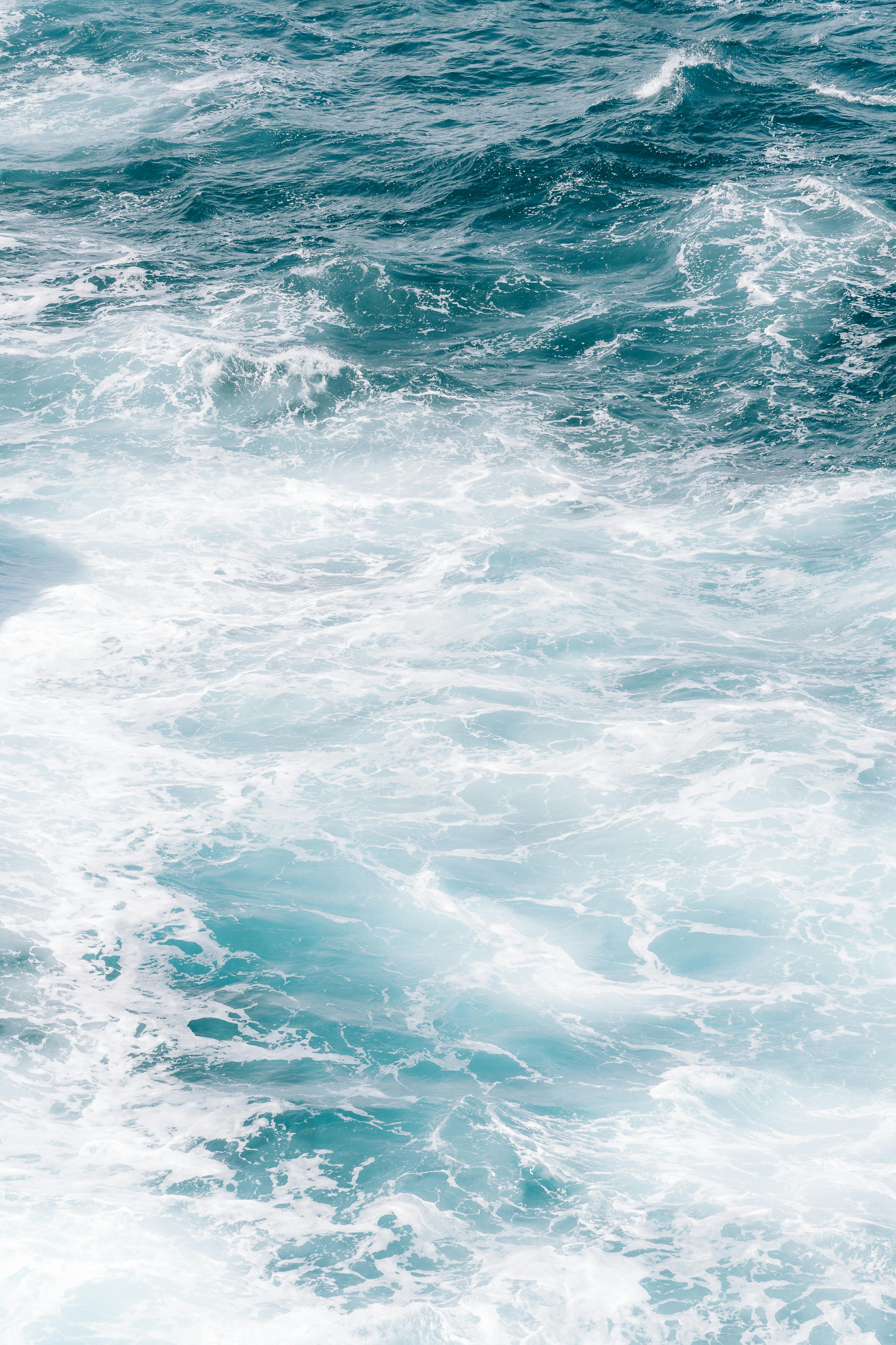 A captivating view of ocean waves creating stunning foam patterns off Torndirrup, Australia.