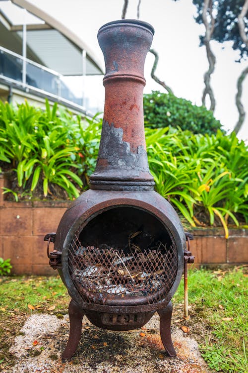 Antique Stove Standing Proudly in the Garden, Adding a Touch of Nostalgia to the Outdoor Space
