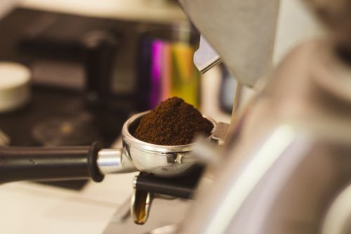 Free A close-up view of freshly ground coffee in a portafilter, ready for brewing espresso. Stock Photo