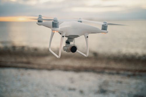 Flying White Quadcopter Drone