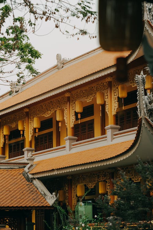 A yellow and orange building with a lot of windows