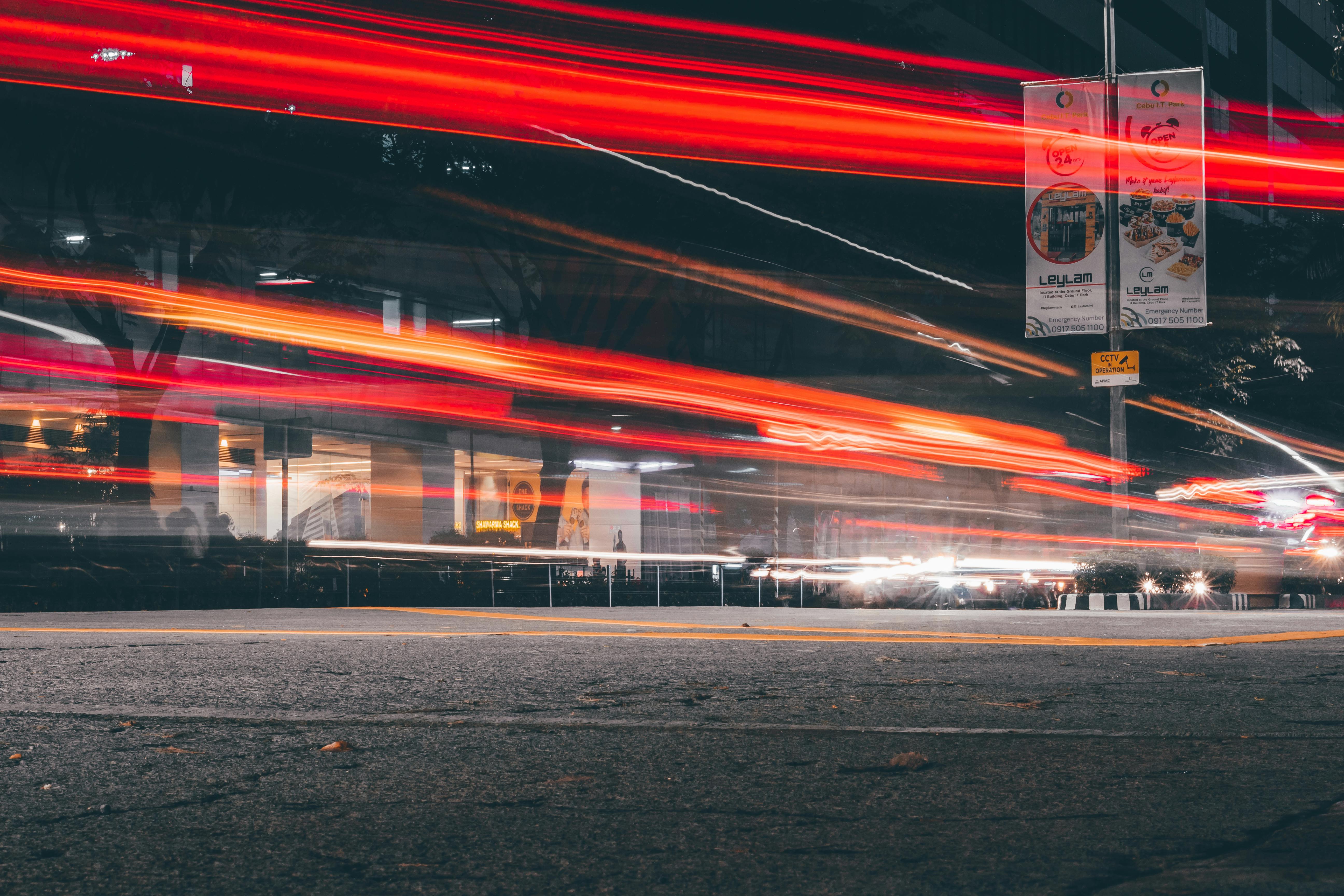 Time Lapse Photography Of Vehicles Passing On Road · Free Stock Photo