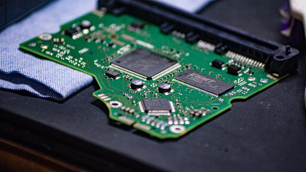 Detailed close-up of a microprocessor circuit board on a workbench in Sri Lanka.