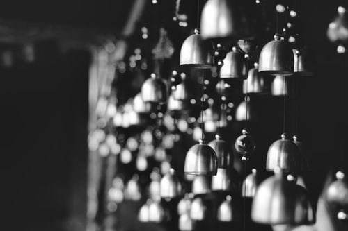 Free Monochrome photo of hanging bells in Darjeeling, India, creating shadows and light play. Stock Photo