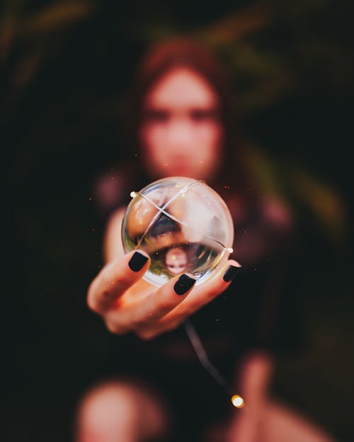 Free Person Holding Clear Glass Ball Using Right Hand Stock Photo