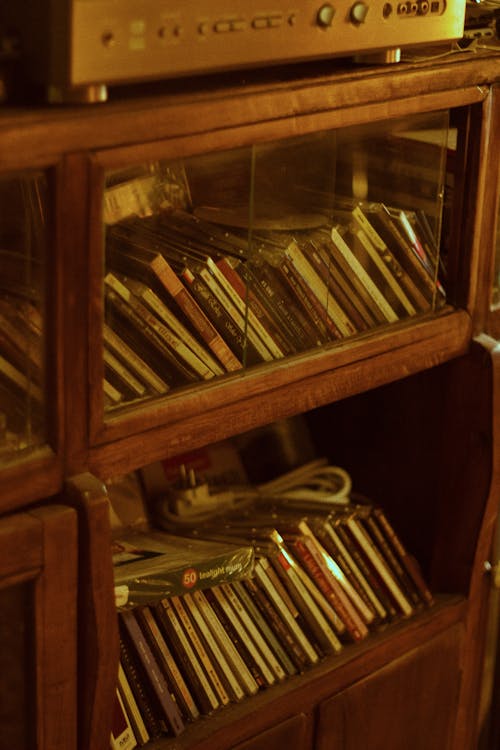 A wooden cabinet with a record player and a radio