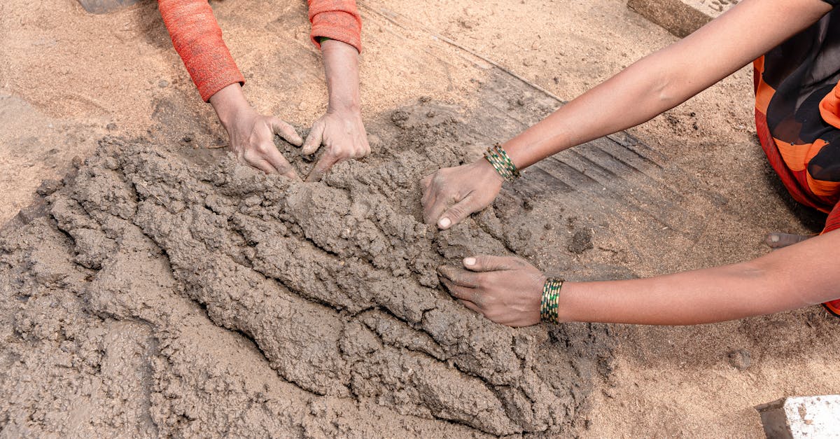 A modern eco-friendly building with solar panels on the roof and a garden on the balcony.