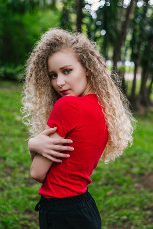 Free Photo of Woman in Red T-shirt and Black Bottoms Posing Stock Photo